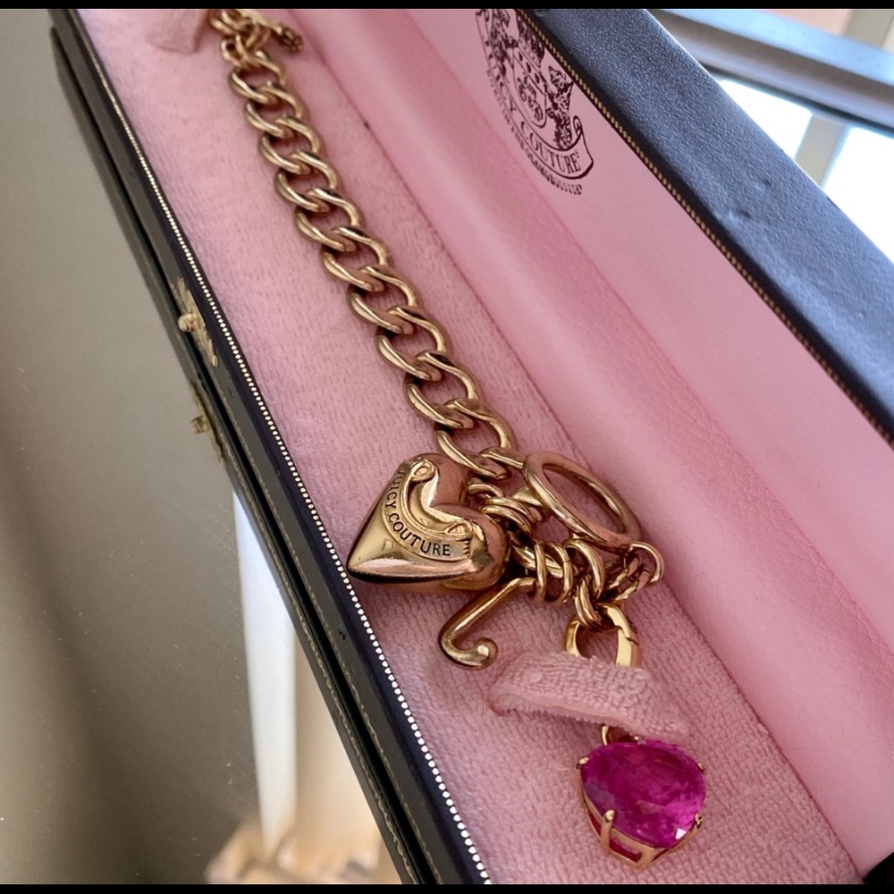 Juicy Couture gold plated bracelet with “J” Juicy charm and pink stone charm.